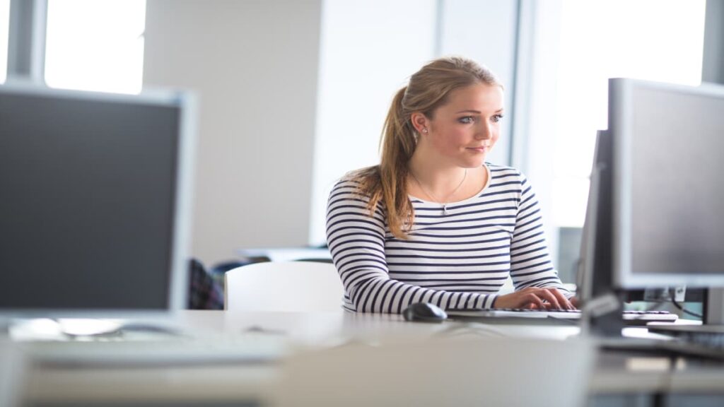 woman studying behind a computer
