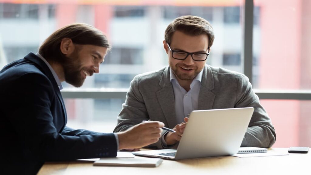 Two man studying with a laptop